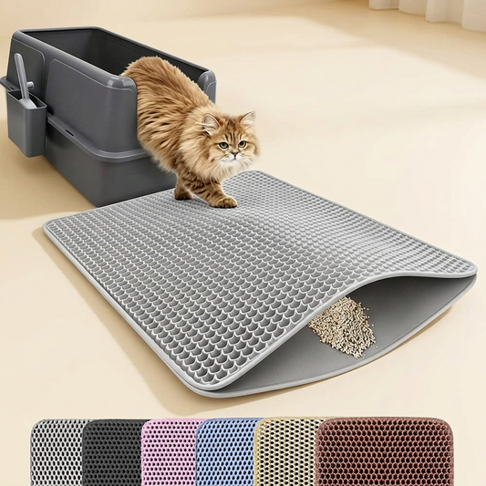 Cat stepping from litter box onto grey honeycomb litter trapping mat