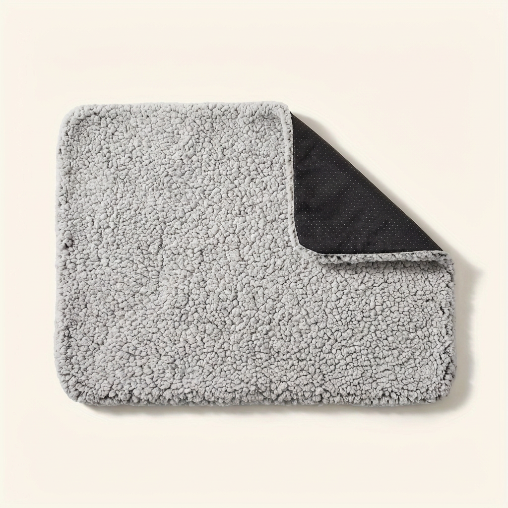 Self-heating pet mat with grey sherpa top on a cream background