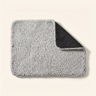 Self-heating pet mat with grey sherpa top on a cream background