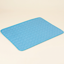 Blue quilted pet cooling mat on a cream background